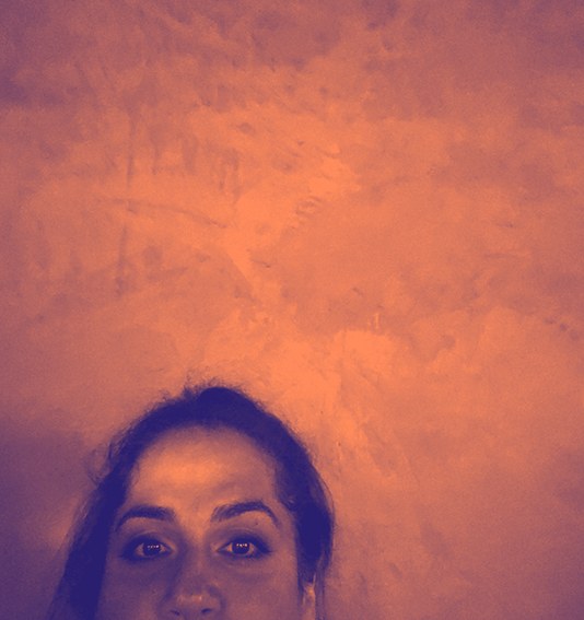 Maryam's portrait in a violet and coral duotone